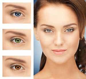 Image of a woman wearing different colored lenses.