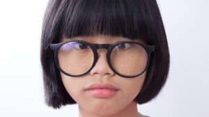 Image of a little girl wearing glasses.