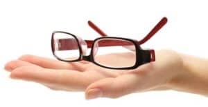 Image of a hand holding glasses.