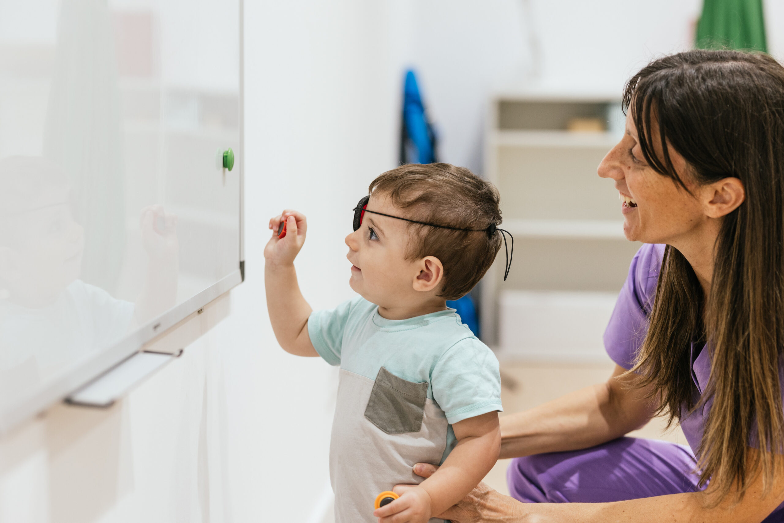 Child completing a vision activity with an adult